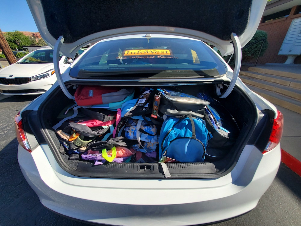 InfoWest-Car-Trunk-Loaded-With-Backpacks